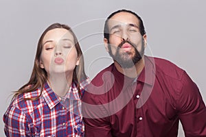 Portrait of funny bearded man and woman in casual style standing