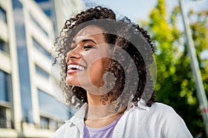 Portrait of funny cheerfu cute girl walking exploring city downtown sunny shiny weather summertime outside