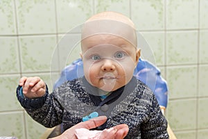 Portrait of a funny child smeared with yogurt