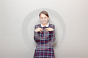 Portrait of funny confused young woman making silly goofy face