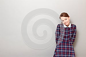 Portrait of funny confused young woman making silly goofy face