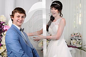 Portrait of funny Couple. Wedding dress. Wedding accessories