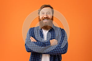 Portrait of funny European redhaired man with beard in glasses