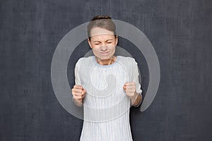 Portrait of funny excited woman being in anticipation