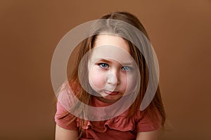 Portrait of funny girl showing emotion of anger