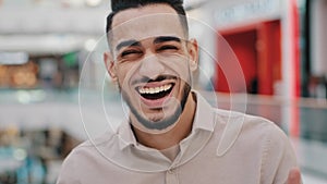 Portrait funny happy Hispanic Indian bearded man Arabian guy Arab male laughing loud sincere smile looking at camera