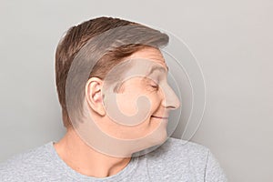 Portrait of funny happy man dreaming about something pleasant