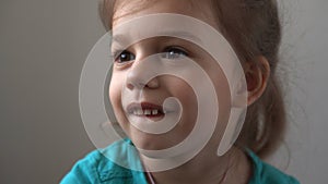 Portrait Funny little close up view happy preschool girl smiling child looking away thoughtfully, pretty natural face