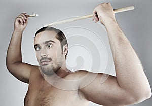 Portrait of funny man Beating drum-type sticks