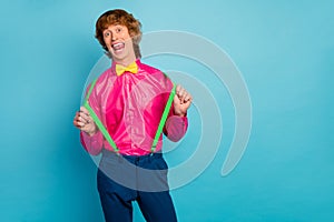 Portrait of funny man pull green suspenders scream joking enjoy free time rest relax wear good look style clothing