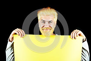 Portrait of funny man showing blank signboard with copyspace area for slogan or text. Discount sale or season sales. For