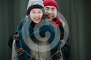 Portrait of a funny middle age couple standing outdoors at winter