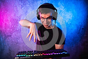 Portrait of funny nerd working on computer