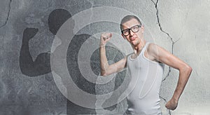 Portrait of a funny skinny bodybuilder. Humorous sportsman using small dumbbells for bodybuilding