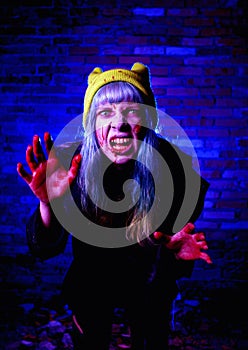 Portrait of funny zombie girl in halloween time