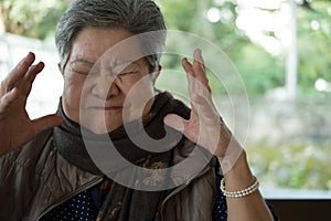 Portrait of furious elder woman, enraged elderly female, angry s