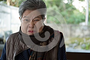 Portrait of furious elder woman, enraged elderly female, angry s