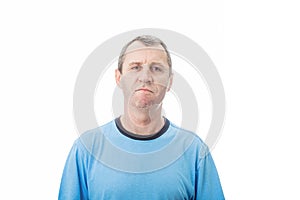 Portrait of furious middle age man looking strained, isolated on white background. Angry casual mature man reacting annoyed,