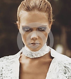 Portrait of a futuristic model of a girl with smoky eyes