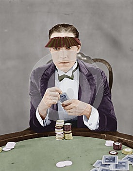 Portrait of gambler at card table