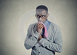 Portrait geeky nervous anxious man bitting chewing his tie