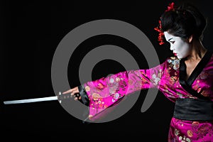 Portrait of geisha warrior with sword