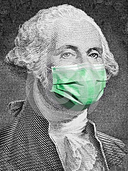 Portrait of George Washington from the 100 American dollar banknote, wearing medical face mask against covid-19 infection. photo