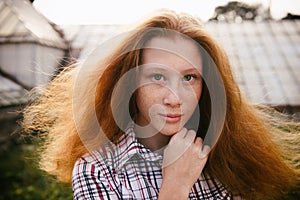 Portrait of ginger haired teenager girl with emotions on face