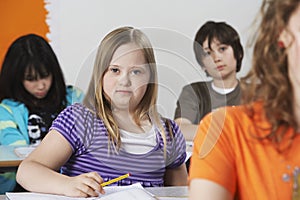 Portrait of girl (10-12) with Down syndrome in classroom