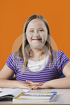 Portrait of girl (10-12) with Down syndrome in classroom