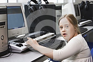 Portrait of girl (10-12) with Down syndrome in home  recording studio