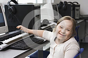 Portrait of girl (10-12) with Down syndrome in home  recording studio