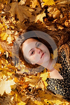 Portrait of girl in the autumn park. Outdoor shot.