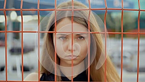 Portrait of a girl on the background of the grid