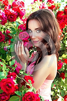 Portrait of a girl on a background of roses