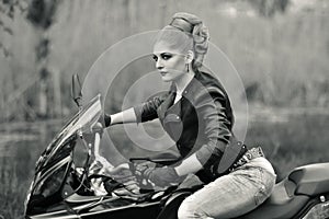 Portrait of a girl on bike,motorbike.Professional blonde biker