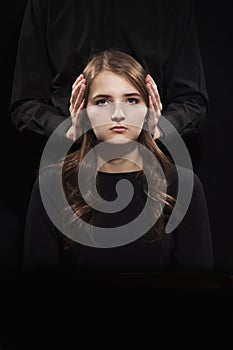 Portrait of a girl on a black background