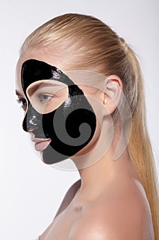 Portrait of girl with black mask on her face