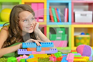 Portrait of girl with colorful plastic blocks