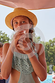 Portrait of girl are drinkig fresh juice, summer mountain landscape