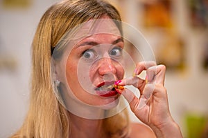 Portrait girl eats big tiger prawn, thailand, pattaya, close up