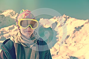 Portrait of a girl in front of a snowy mountainscape, vintage