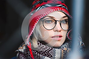 Portrait of a girl with glasses and hat