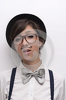 Portrait of a girl in hat with glasses and mustach