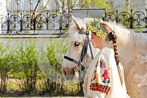 Portrait of a girl and her horse