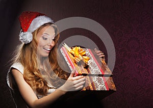 Portrait of a girl holding a Christmas present