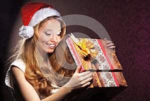 Portrait of a girl holding a Christmas present