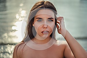 Portrait of a girl holding hair on the wind