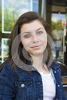 Portrait of girl in jacket at summer day