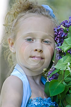 Portrait of girl with lilacs